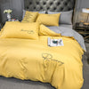 Plain Bedding Set with Yellow and Gray Embroidered Script